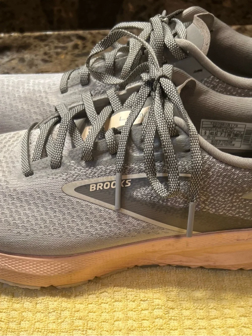 Brooks gray running shoes with pinkish peach midsole